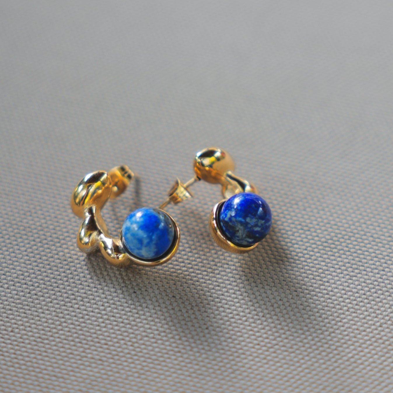 Dali Inspired Gold and Blue Stone Earrings